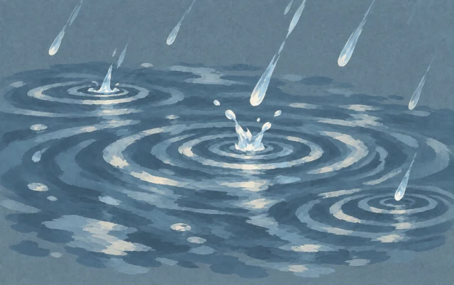 A few diagonal raindrops fall into a small pool, leaving overlapping circular ripples.