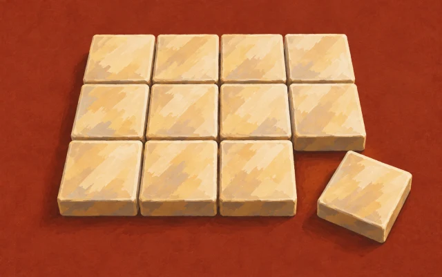 An orderly grid of interlocking tiles has one edge piece pulled slightly out of place.